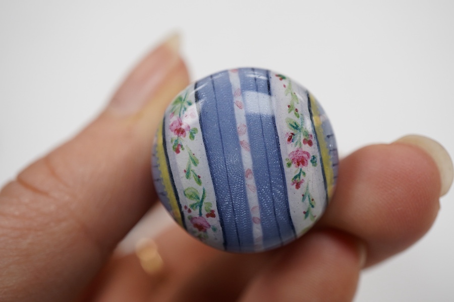 A late 19th century yellow metal and polychrome enamel desk seal, with rock crystal matrix, carved with a monogram, 69mm (small chip to the enamel), in original J.C Vickery fitted gilt tooled leather box.